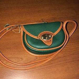 Dooney and Burke green crossbody leather bag.